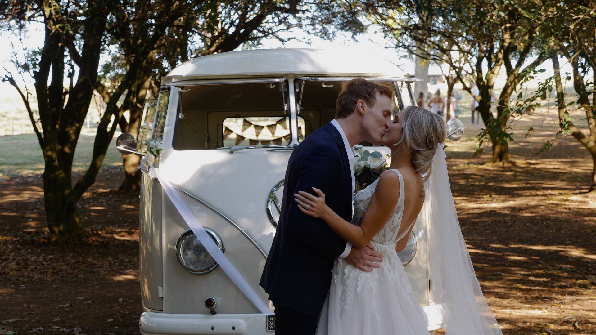 Newly married couple in front of kombi van - wedding videography services in Byron Bay and surrounding areas - Lovereel