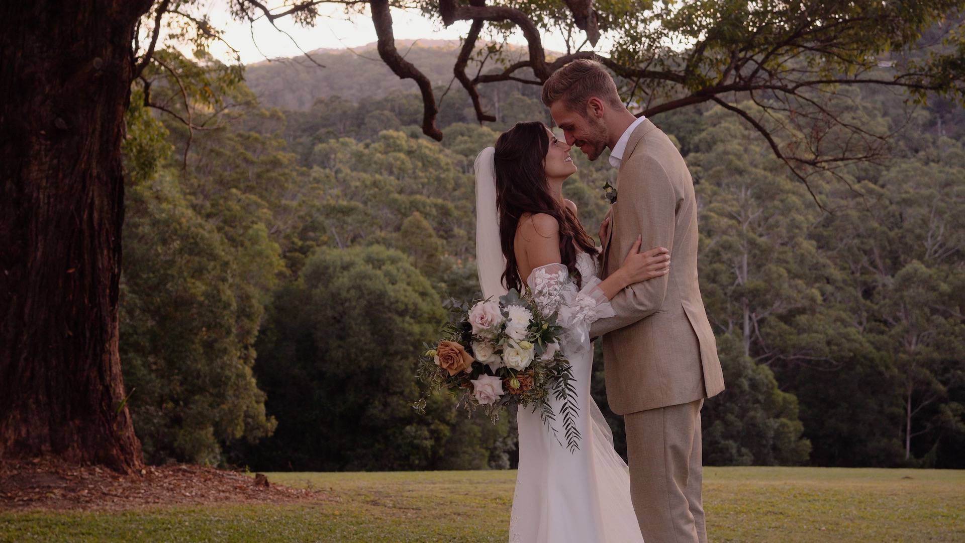Newly married couple under an old tree in Gold Coast Hinterland - wedding videography services in Gold Coast and surrounding areas - Lovereel