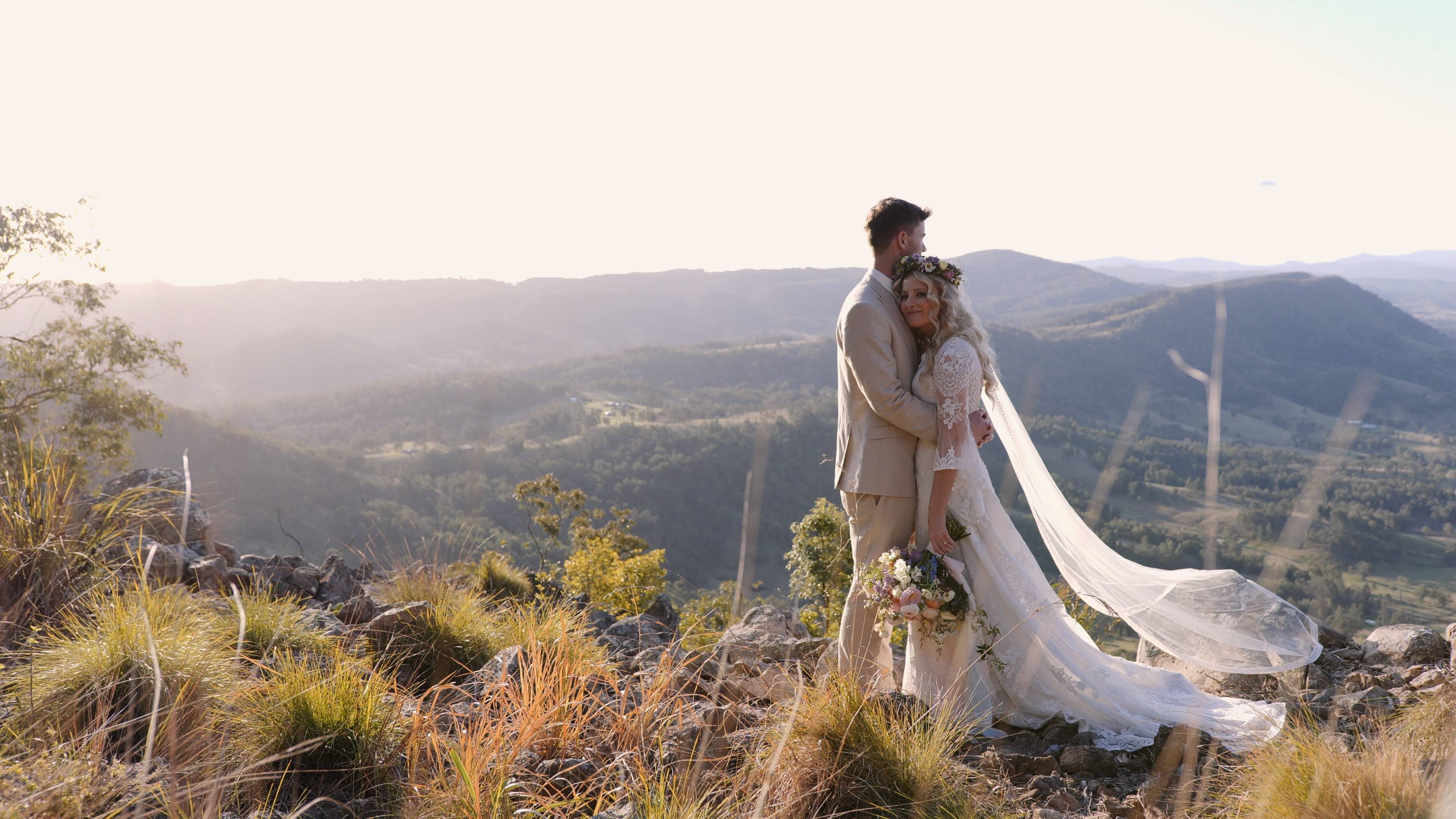 Newly married couple posing in an open field - photographer and wedding videographer Hunter Valley - Lovereel